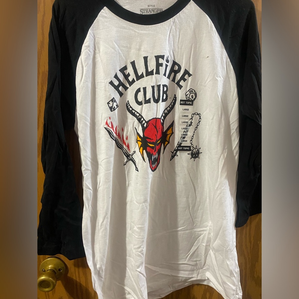 Quarter sleeve stranger things tshirt. New never worn. No stain or damage.Size L